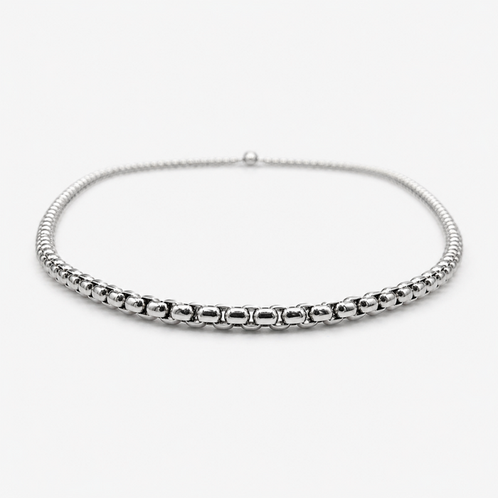 Low angle view of stainless steel 2mm rounded box chain necklace showing thickness and profile