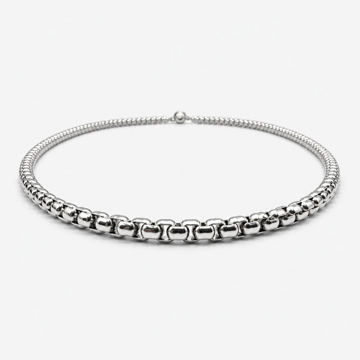 Low angle view of stainless steel 3mm rounded box chain necklace showing thickness and profile