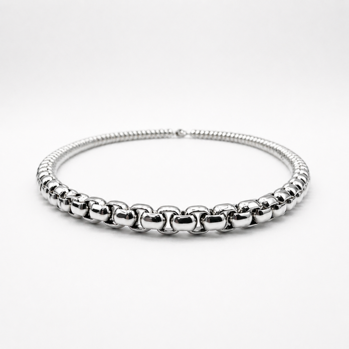 Low angle view of stainless steel 4mm rounded box chain necklace showing thickness and profile