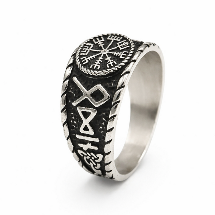 Angled view of a stainless steel Vegvisir ring showing the engraved Viking compass design and decorative Norse detailing