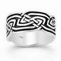 Sterling silver Celtic loop knot ring with oxidised detail on a natural background