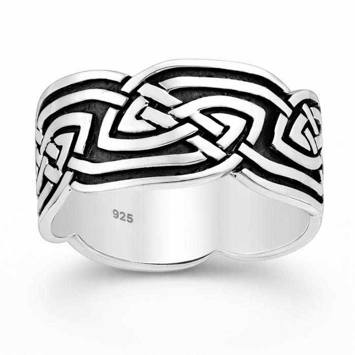Sterling silver Celtic loop knot ring with oxidised detail on a natural background