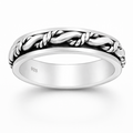Sterling silver rope spin ring with rotating band on a natural background