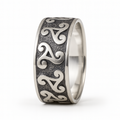 Sterling silver triskele ring with oxidised Celtic spiral design on a clean white background