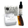 The Brighton Beard Co beard care gift set with beard shampoo, beard balm, beard oil and amber beard comb on white background
