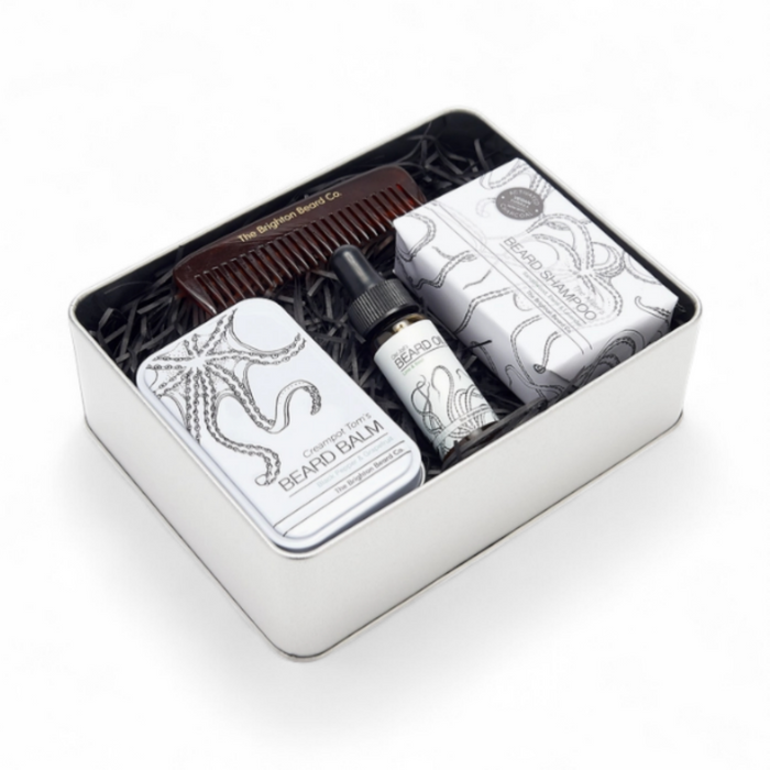 Open Beard Starter Kit by The Brighton Beard Co. showing beard oil, balm, shampoo bar and comb