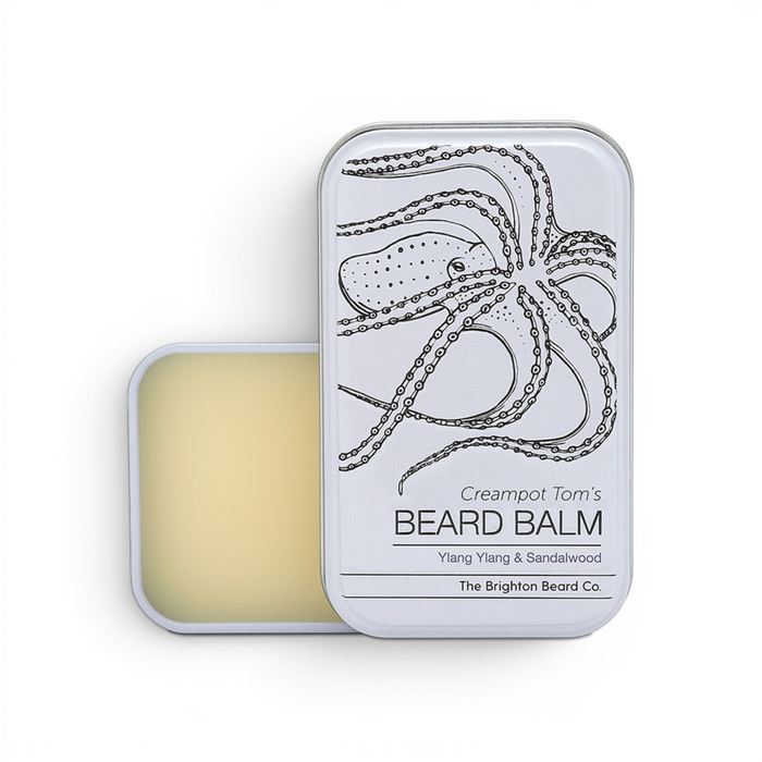 Top view of Creampot Tom’s ylang ylang and sandalwood beard balm tin showing lid design