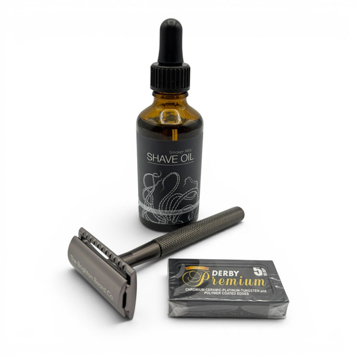 The Brighton Beard Co. Traditional Shave Kit with safety razor, shave oil and Derby razor blades on a white background