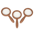Three brown magnifying glasses with white lenses on a white background