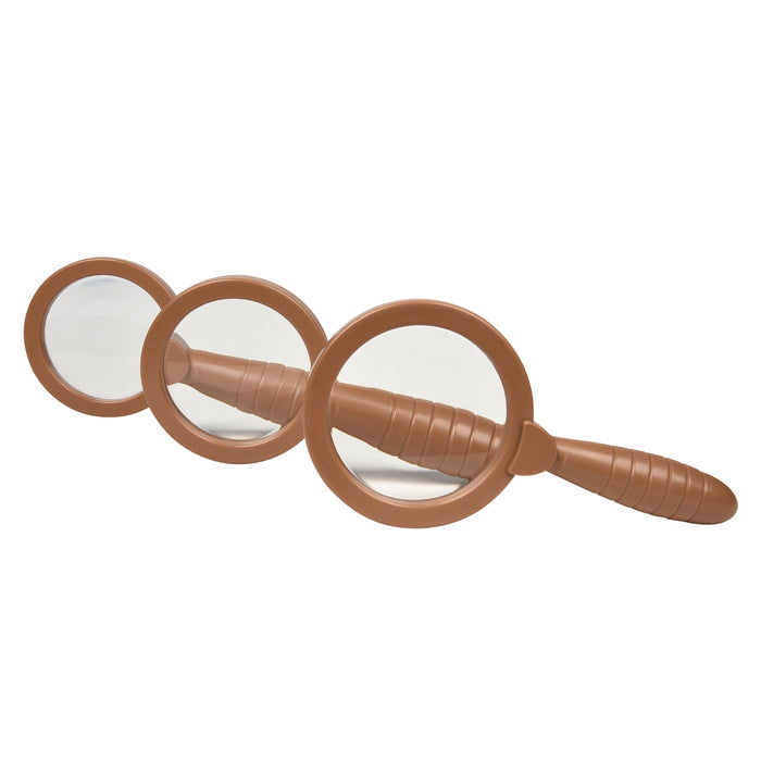 Brown magnifying glass with three circular lenses on a white background