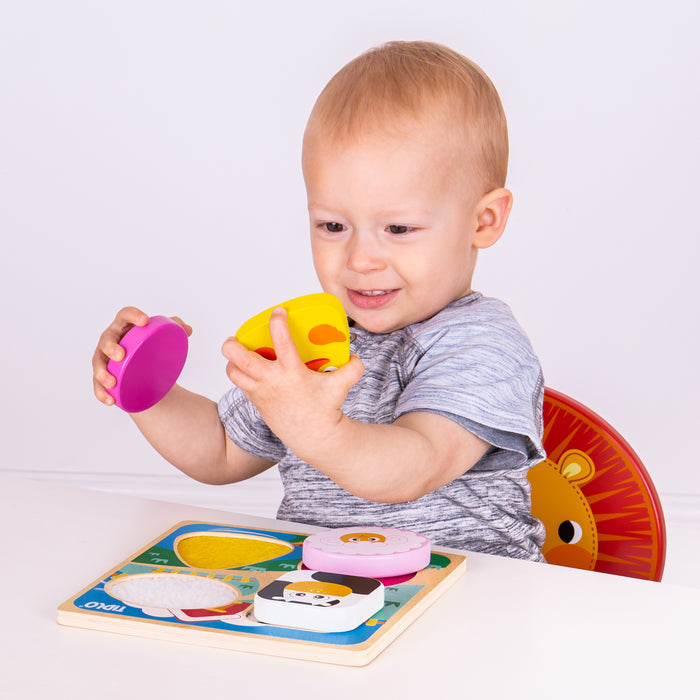 Child playing with colorful educational toys on a white background