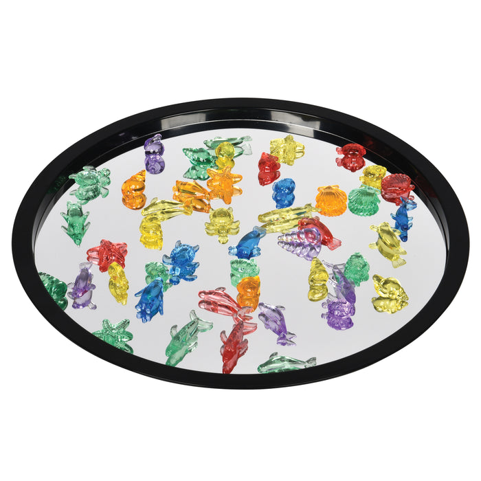 Colorful ocean themed figures on a white tray with a black rim