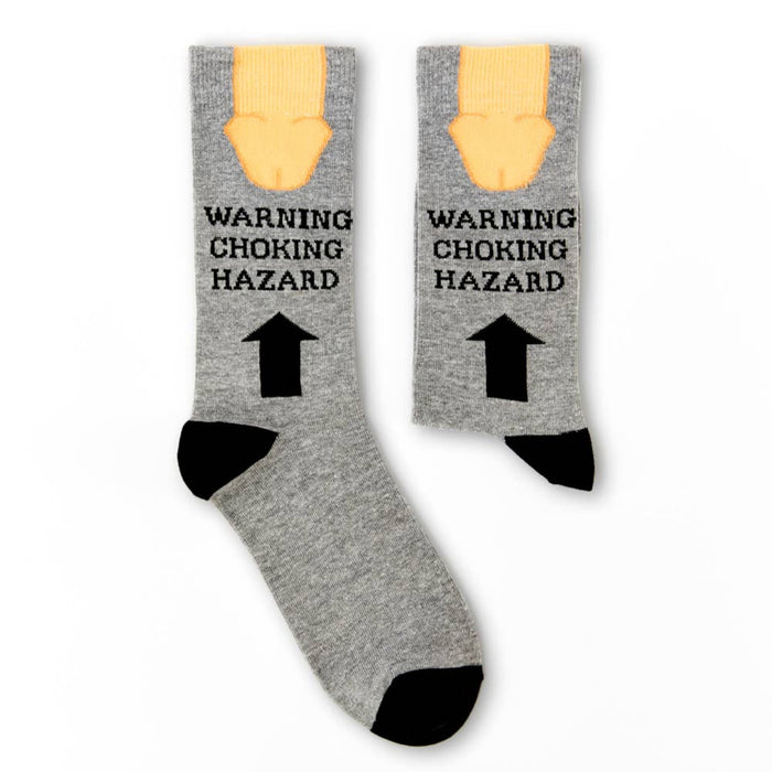 pair of Warning Choking Hazard novelty socks laid flat showing full design