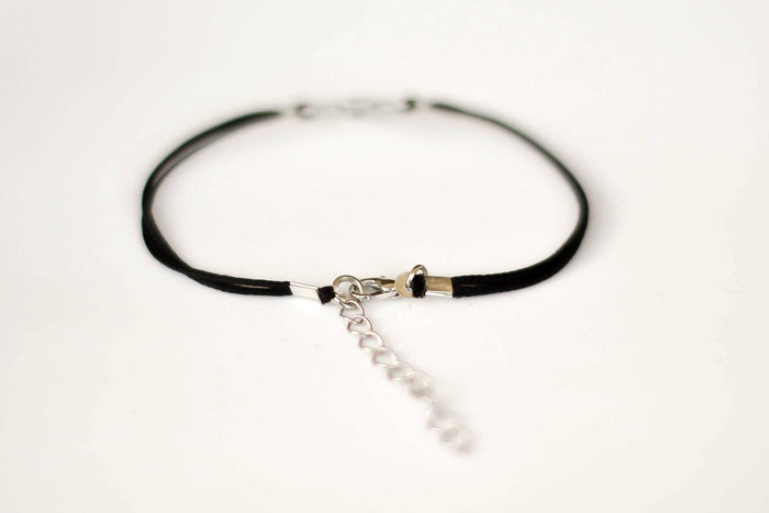 Women bracelet with silver outline cross charm, black cord - shani-adi-jewerly