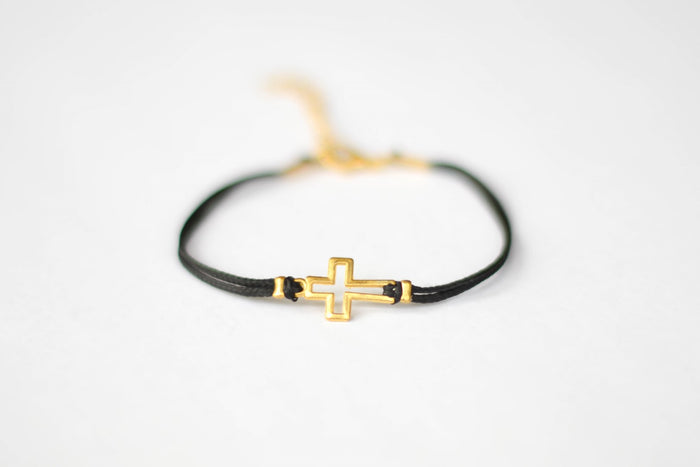 Women's bracelet with gold tone outline cross charm, black cord - shani-adi-jewerly